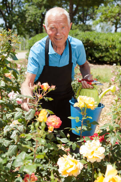istock Man holding bucket and watering can 1187667907