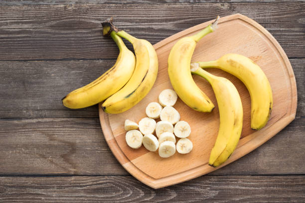 istock Banana on the wooden background. Top view. 1187668757