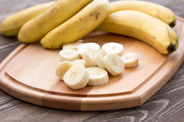istock Fresh bananas on wooden background. 1187668902