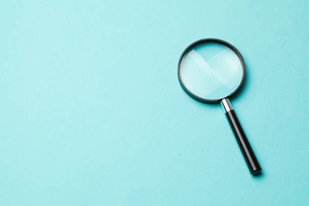 istock Magnifying glass. Search tool. Green background. 1187669710