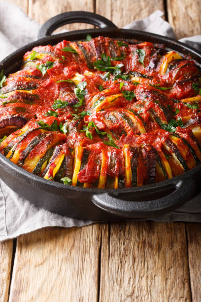 istock Vegetarian baked vegetable mix in tomato sauce close-up. vertical 1187669832