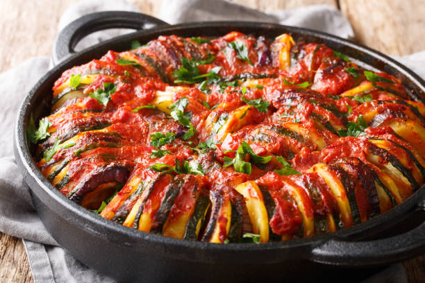 istock Mediterranean baked various vegetables in tomato sauce close-up in a pan. horizontal 1187670633