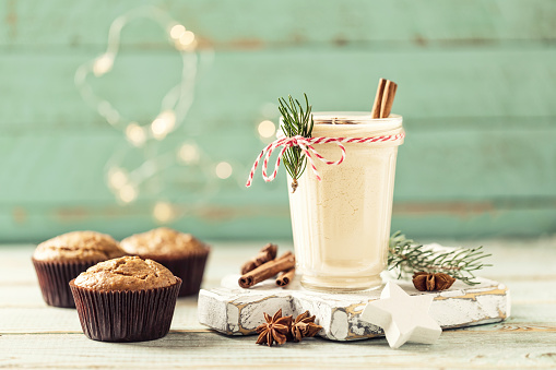 Eggnog. Traditional Christmas drink, spiced egg-milk cocktail with nut topping.