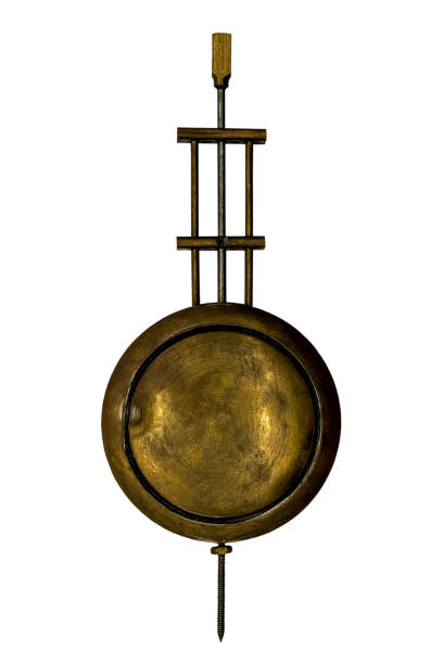 old pendulum of a wall clock stock photo