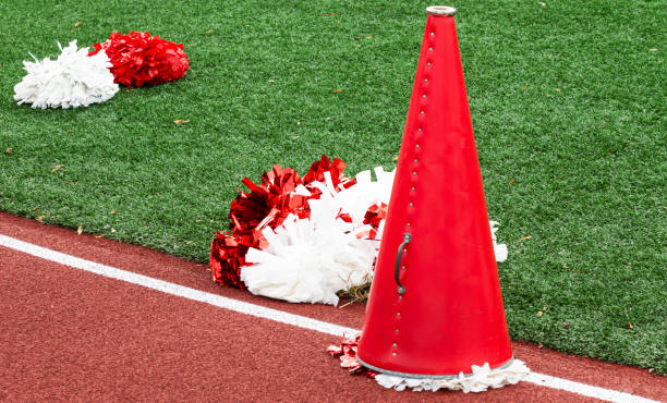 Cheerleaders megaphone and pom poms