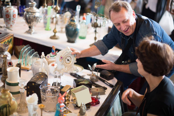 istock Happy tourists study the range of flea market 1187675991