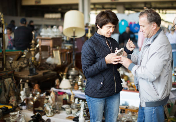 istock Mature couple choosing vintage artifacts at fleamarket 1187676030