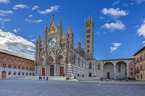 Siena Tuscany, Italy - May 12, 2016: Duomo di Siena is a romanesque-gothic cathedral it is a major tourism attraction in Siena.