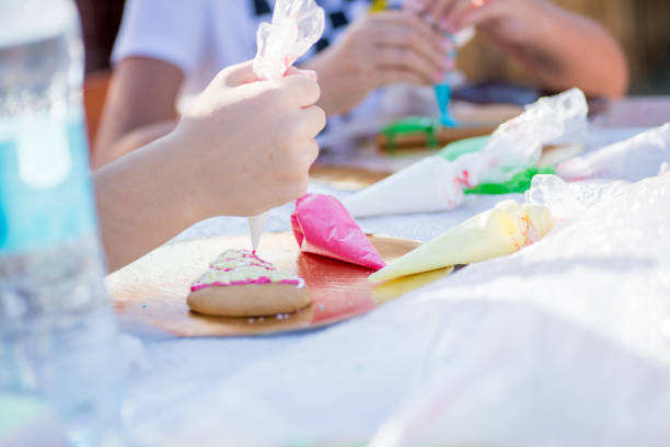 istock child draws on gingerbread with glaze 1187676743
