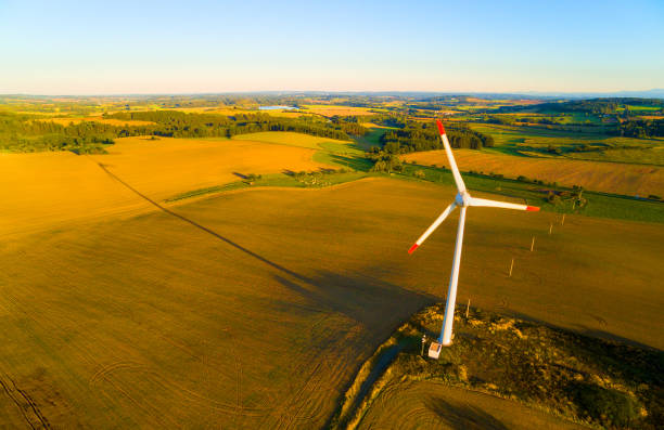 istock Wind turbine in landscape as a metaphoric expression for climate change.  Aerial view to windmill. 1187677590