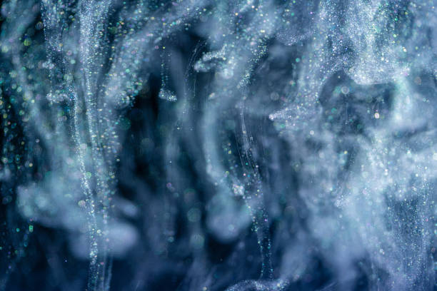 istock Shiny acrylic ink with glitter floating in the water 1187677749