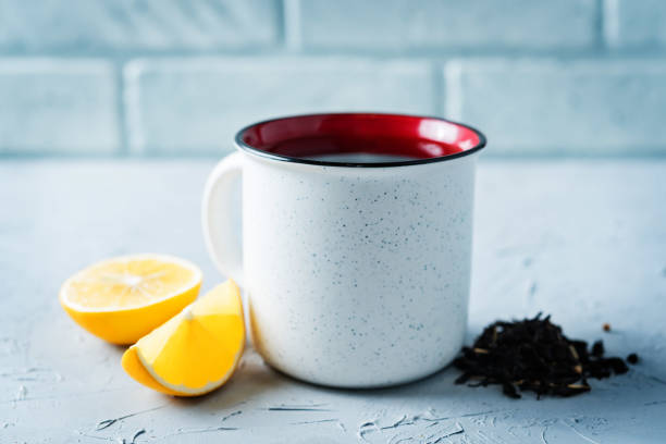 istock Cup of black tea with honey, lemon and ginger 1187680033