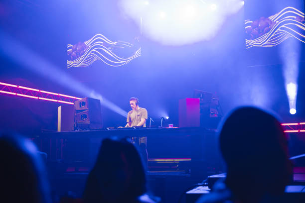 istock Dj playing techno music on the stage 1187680460