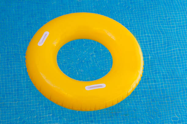 istock Yellow float on a pool with crystal clear water 1187681425