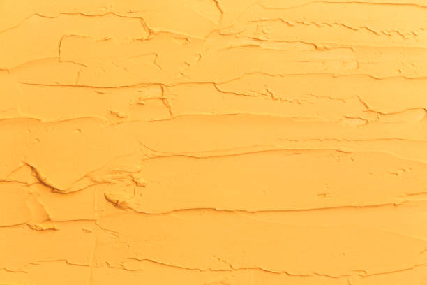 istock Yellow Red Painted Wall. Old Paint Background texture with copy space for text 1187684076