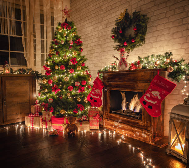 istock Decorated Christmas Tree Near Fireplace at Home 1187685686