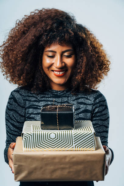 istock Attractive Woman with a present for a christmas festivity 1187686209