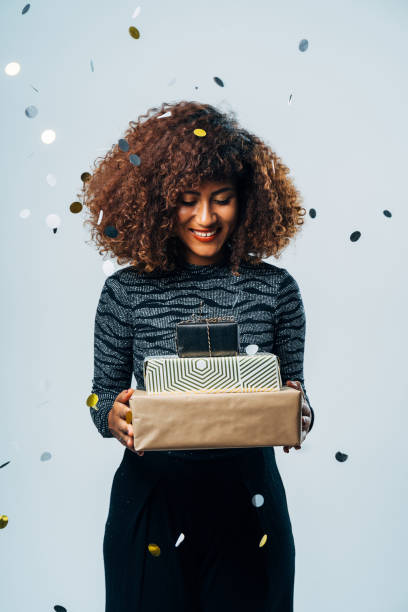 istock Attractive Woman with a present for a christmas festivity 1187686210