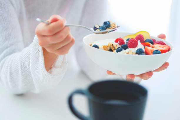 istock Woman Eating healthy breakfast bowl. 1187687993