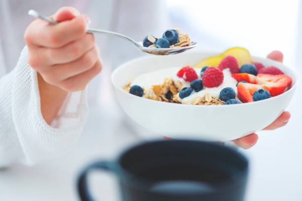 istock Woman Eating healthy breakfast bowl. 1187687994