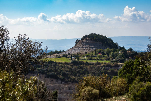 istock A hill surrounded with forest and small village 1187688715