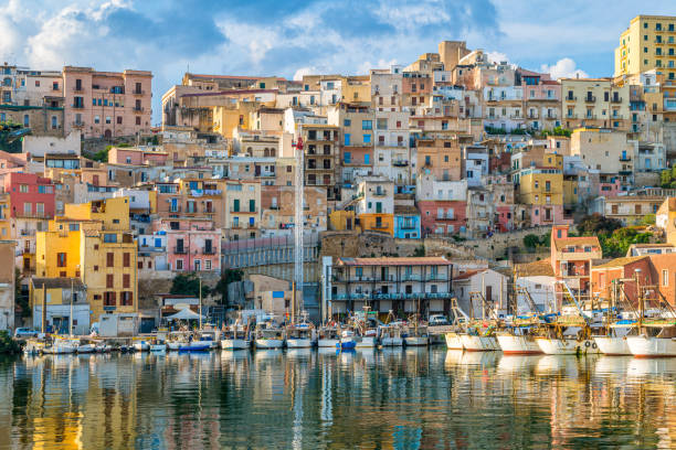 The colorful city of Sciacca overlooking its harbour. Province of Agrigento, Sicily. The colorful city of Sciacca overlooking its harbour. Province of Agrigento, Sicily. anchored photos stock pictures, royalty-free photos & images