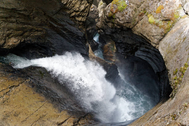 Trummelbach Falls Lauterbrunnen Switzerland. The waterfalls and unique rock formations are inside a mountain fed by melt water from the Alps.