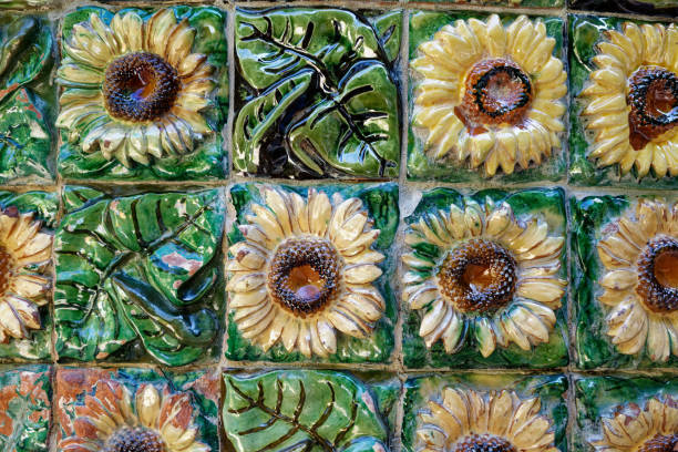 Tiles of sunflowers designed by Antoni Gaudi and adorning Capricho.