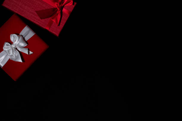 istock Christmas gifts presents simple classic black background border 1187704183