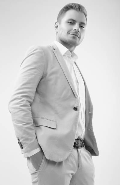 istock Handsome blonde man model in a fashion gray suit in studio 1187705861