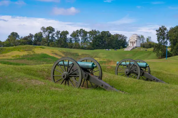 Cannons used in the Civil War  at the Vicksburg National Military Park in Vicksburg, Mississippi near Jackson. Illinois monument in the distance.