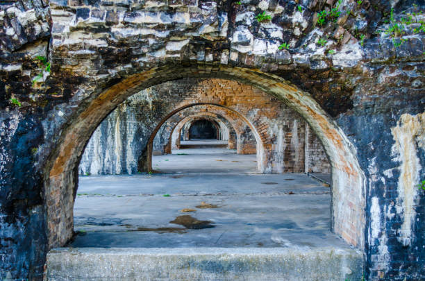 Fort Pickens structure located near Pensacola, Florida, USA. Beautiful weathered brick arches at scenic historic tourist destination location. Recreational sightseeing activity when visiting Gulf Coast beaches. stock photo