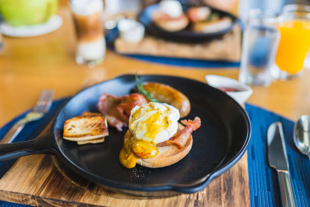 istock Breakfast set with egg benedict sausage in hot pan 1187712067