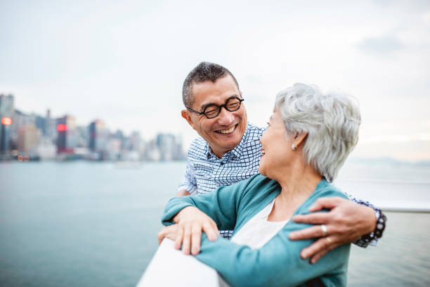 Chinese Seniors Enjoying Views from Ocean Terminal Deck Close-up of smiling Chinese seniors enjoying panoramic views of Hong Kong from Harbour City’s Ocean Terminal Deck. ++ NB: Attached PR for Harbour City covers Ocean Terminal Deck which is on the roof of the shopping centre. Mention of both in metadata has been approved. view into land stock pictures, royalty-free photos & images