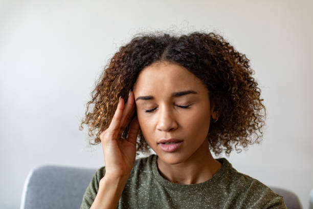 istock Woman Experiencing a Headache 1187713052