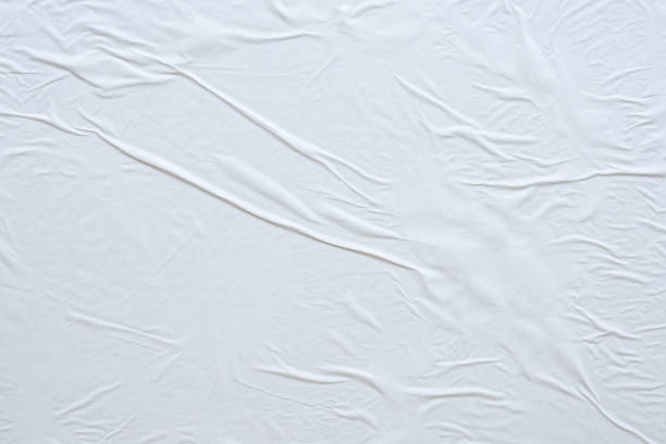 istock Blank white crumpled and creased paper poster texture background 1187713073