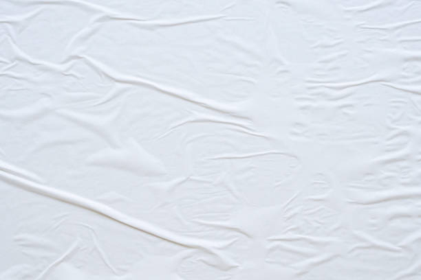 istock Blank white crumpled and creased paper poster texture background 1187713074