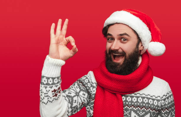 istock Cheerful hipster gesturing OK on Christmas Day 1187713354