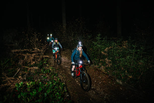 istock Women's Mountain Biking Club on Night Ride 1187720535