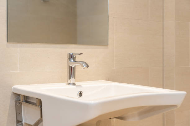 istock White sink with water faucet decoration in bathroom 1187732936