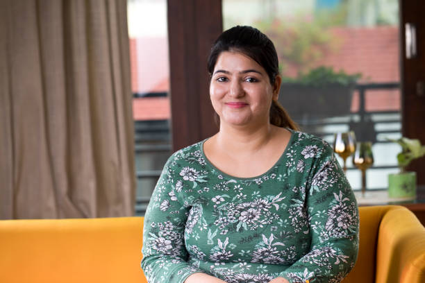 istock woman looking at camera at home 1187741338