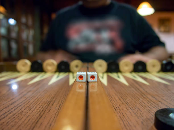 istock Night time two dices showing one point on the backgammon board frame 1187742444