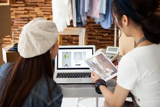 Photo of Two women selling clothes at online shopping