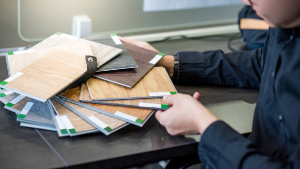 istock Asian architect man choosing wooden color swatch 1187745525