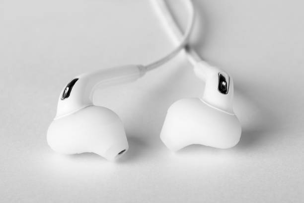 istock White headphone close-up. A modern headset for mobile devices. 1187746304