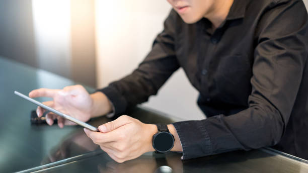 istock Asian businessman using digital tablet in office 1187747839