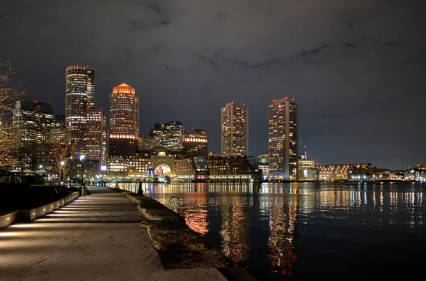 istock boston skyline from seaport harbor at night 1187750472