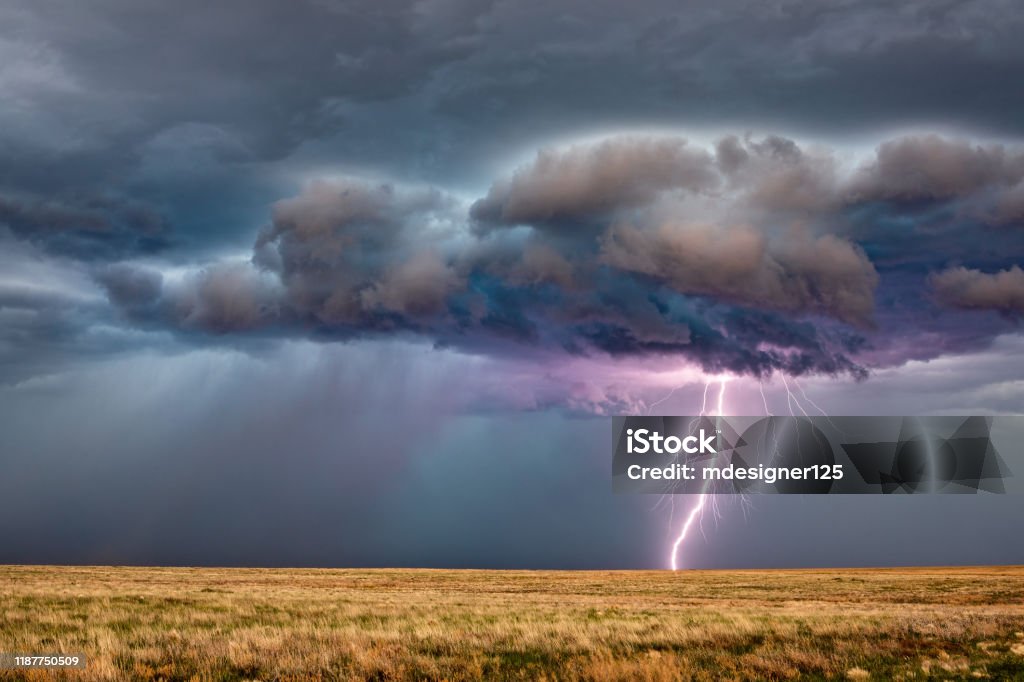 Thunderstorm lightning Thunderstorm with lightning bolt strike and dark storm clouds. Lightning Stock Photo