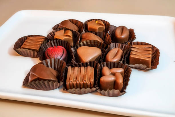 istock close up special chocolates with different figures in white plate on white background. 1187751259