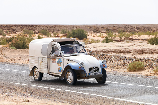 Oued Amerbouh, Morocco - September 26, 2019: Retro car Citroen 2CV Fourgonnette takes part in the 2CV Maroc Dunas Raid IV Edition.